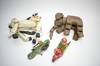 Lot 323 - A clockwork tinplate motorcycle and rider figure and three others