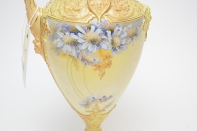 Lot 456 - A Royal Worcester blush ivory ewer, handpainted with blue floral sprays