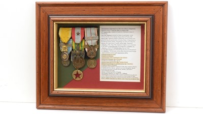 Lot 1022 - A group of medals awarded to an anonymous Legionnaire of the 13e D.B.L.E.