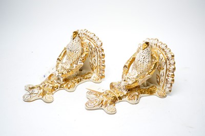 Lot 396 - A pair of Staffordshire wall sconces