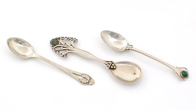 Lot 244 - A handmade silver caddy spoon; and two silver teaspoons