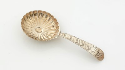 Lot 265 - A rare Georgian III "double duty" silver caddy spoon