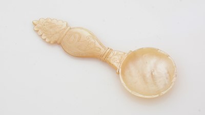 Lot 273 - A 19th Century carved mother-of-pearl caddy spoon