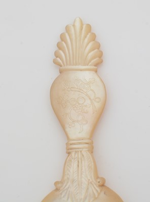 Lot 273 - A 19th Century carved mother-of-pearl caddy spoon