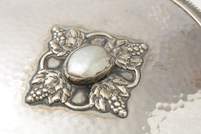 Lot 42 - A George V Arts and Crafts hand mirror