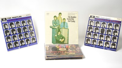 Lot 317 - 12 Beatles and associated LPs