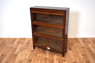 Lot 1 - A 20th Century oak framed three section graduated stacking Globe Wernicke style glazed bookcase