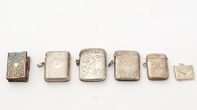 Lot 388 - An Edwardian silver vesta case; and three other antique silver vesta cases