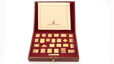 Lot 6 - An Elizabeth II limited edition set of 25 silver-gilt replica postage stamps; and another