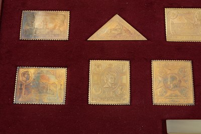 Lot 6 - An Elizabeth II limited edition set of 25 silver-gilt replica postage stamps; and another