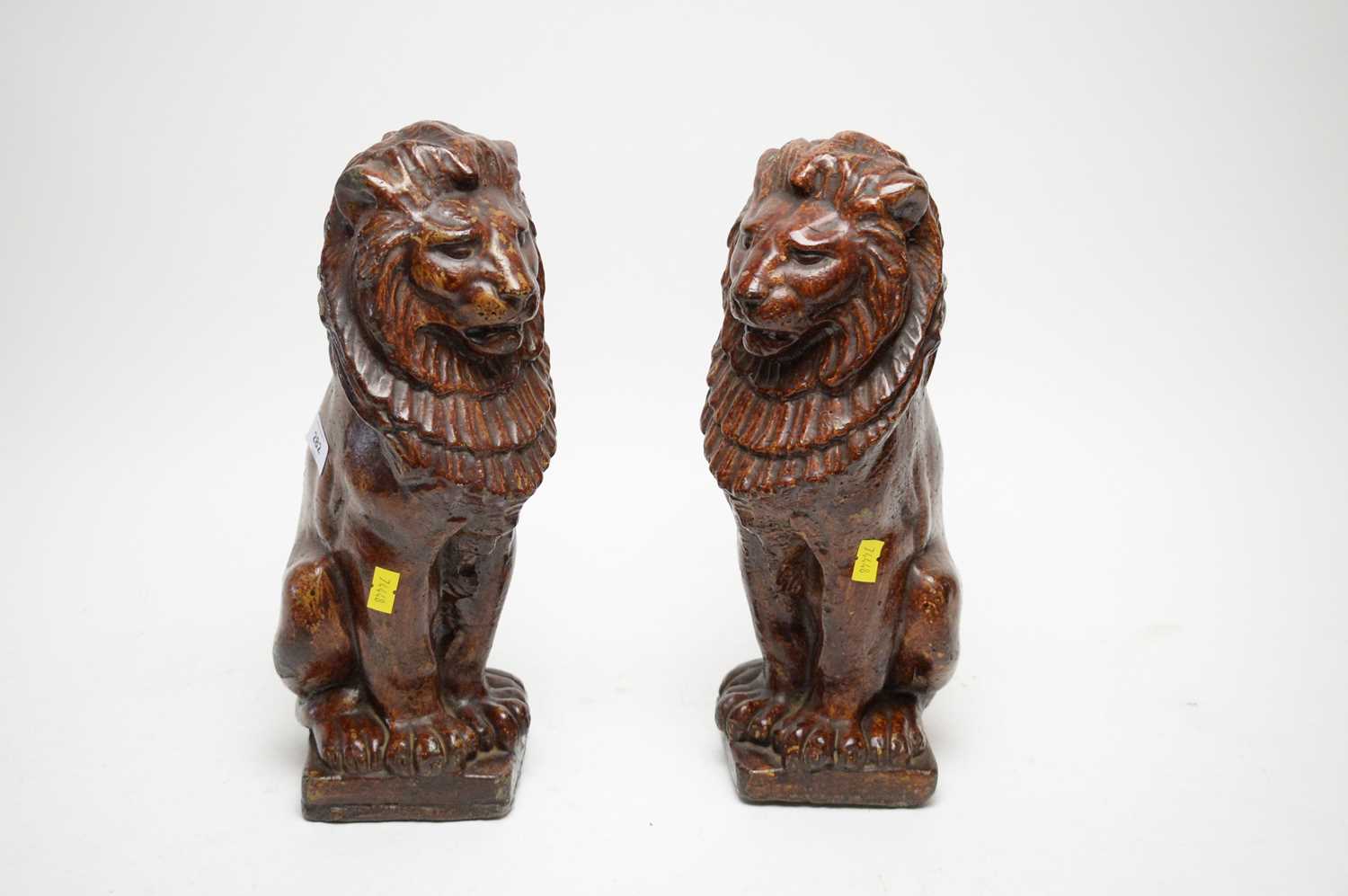 Lot 282 - A pair of Victorian salt glazed pottery lions