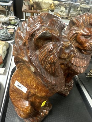 Lot 282 - A pair of Victorian salt glazed pottery lions