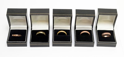 Lot 119 - Five 9ct yellow and rose gold wedding bands