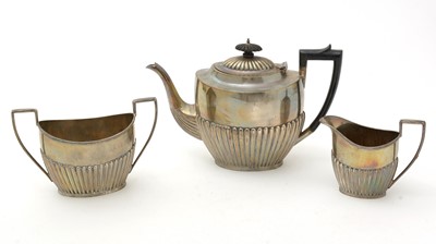 Lot 1027 - A three piece silver tea service, by James Deakin & Sons