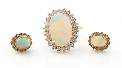 Lot 522 - An opal and diamond cluster ring, and a pair of opal earrings