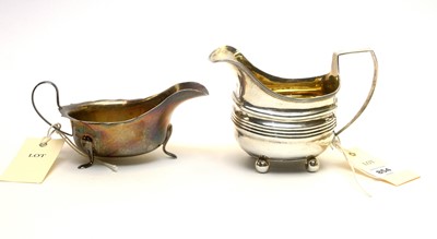 Lot 854 - A George III silver milk jug, and a silver sauce boat