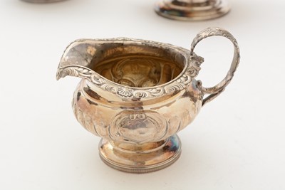 Lot 84 - A George III/IV Scottish silver three-piece tea service