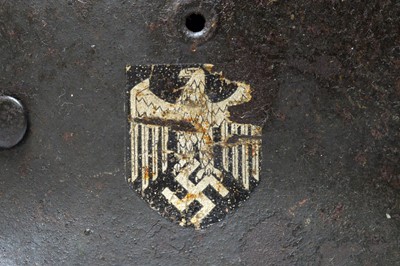 Lot 1010 - A German Second World War M35 pattern helmet