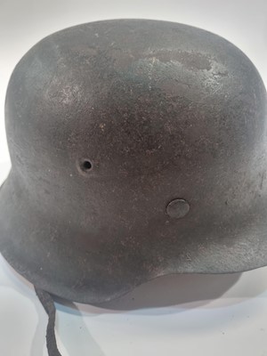 Lot 1010 - A German Second World War M35 pattern helmet