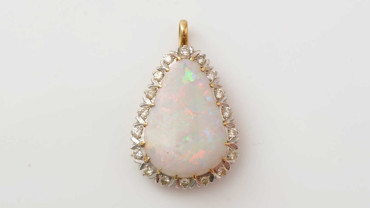 Lot 432 - An opal and diamond cluster pendant