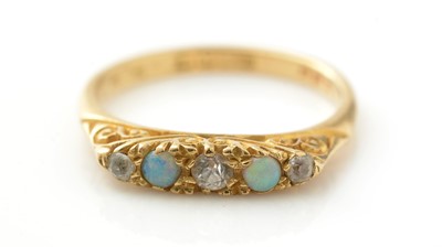 Lot 801 - An opal and white stone ring
