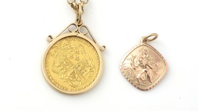 Lot 986 - A George III gold half guinea pendant on chain and another