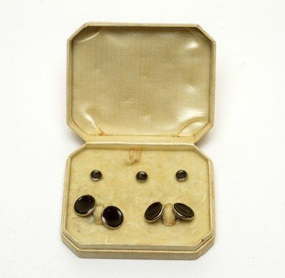 Lot 1135 - A pair of 14ct white gold cufflinks and studs