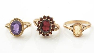 Lot 936 - Three 9ct yellow gold and gem set rings