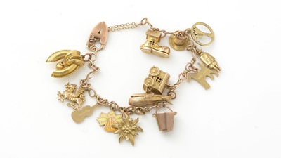 Lot 922 - A 9ct yellow gold charm bracelet