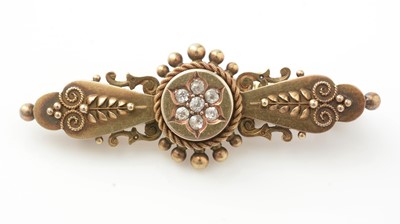 Lot 989 - A 15ct yellow gold and diamond brooch