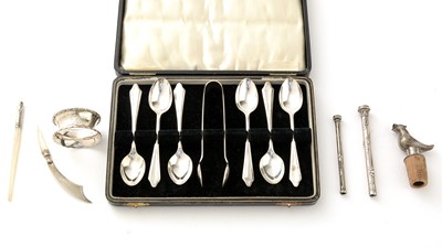 Lot 756 - A set of six silver teaspoons with matching sugar tongs, and other items