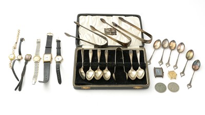 Lot 994 - A selection of silver spoons, tongs and other items