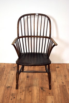 Lot 14 - A 19th Century beech and elm comb back Windsor rocking chair