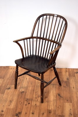 Lot 14 - A 19th Century beech and elm comb back Windsor rocking chair