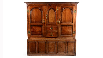 Lot 1309 - A large 18th Century oak clothes press/livery cupboard