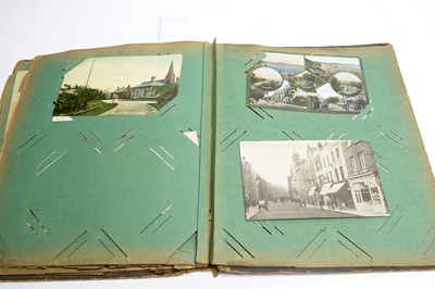 Lot 331 - Three early 20th Century postcard albums; together with loose vintage postcards