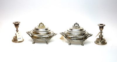 Lot 1072 - A pair of 19th Century sauce tureens; and a pair of candlesticks