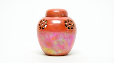 Lot 851 - Small Ruskin orange lustre jar and cover