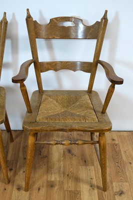 Lot 11 - An oak extending dining table and chairs