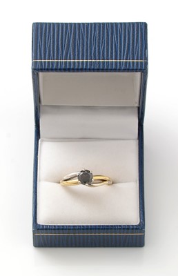 Lot 158 - A solitaire black diamond ring