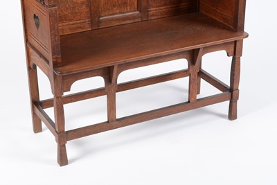 Lot 1310 - An early 20th Century Arts and Crafts oak hall settle by Shapland and Petter