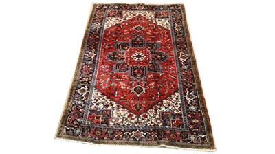 Lot 1208 - A Heriz carpet