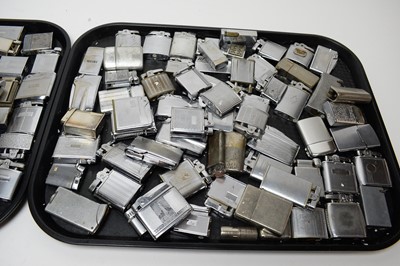 Lot 258 - A collection of silver plated cigarette lighters, of various designs and makers