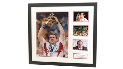 Lot 771 - Martin Johnson (1970-): a signed photograph raising the World Cup in 2003