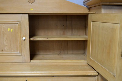 Lot 53 - A large stripped pine compactum/wardrobe