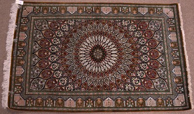 Lot 91 - An Indian Kasmir rug, the central star medallion set within a panel