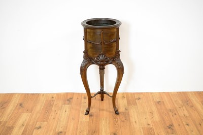 Lot 8 - A decorative 20th Century copper lined mahogany jardinière planter in the French taste.