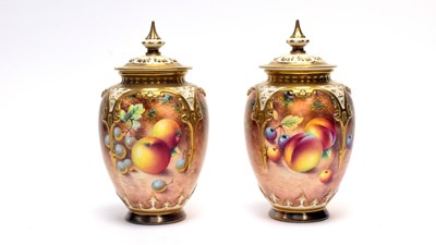 Lot 858A - Pair of Royal Worcester fruit painted vases and covers by Roberts