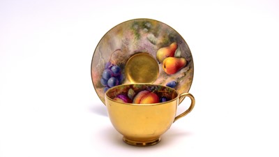 Lot 861 - Royal Worcester fruit painted cup and saucer by Ricketts and Austin.