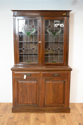 Lot 25 - An early 20th Century Arts & Crafts style glazed bookcase